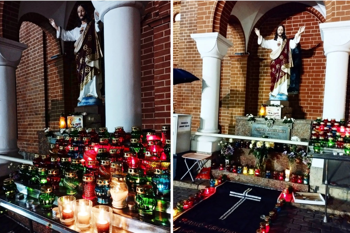 Верующие несут лампадки к стенам закрытого Красного костела в Минске
